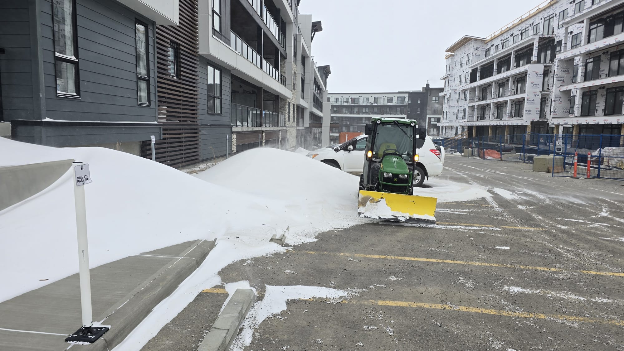 Snow removal service clearing a Calgary driveway